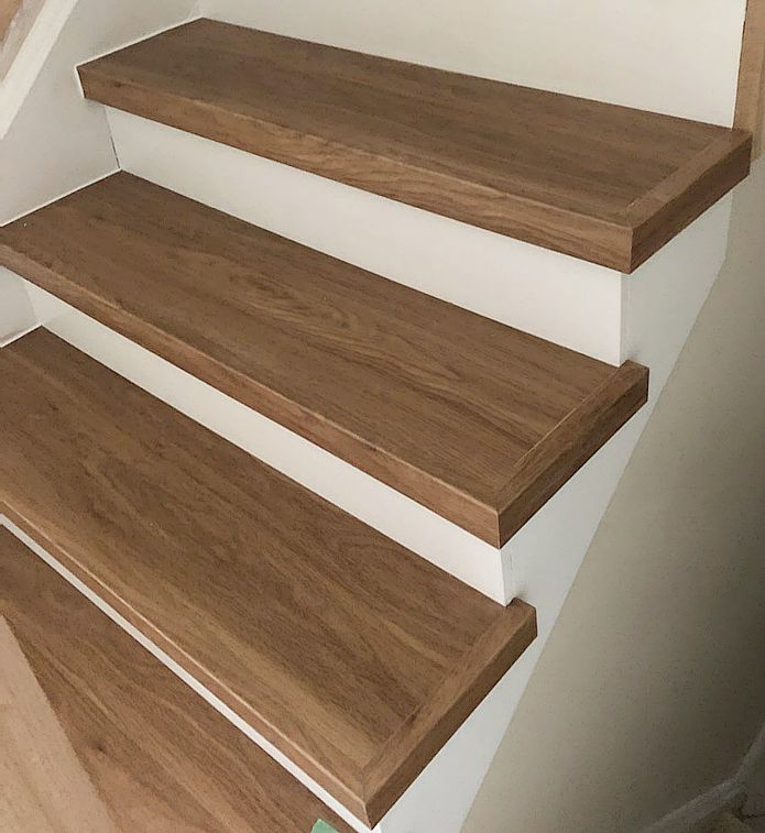 Vinyl plank staircase coverings.